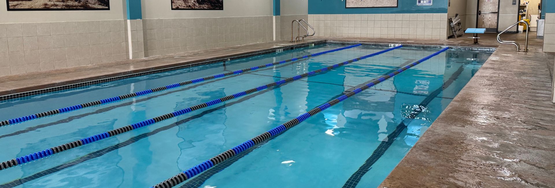 Indoor 4-lane saltwater lap pool at Princeton Club with lane lines and pool deck seating